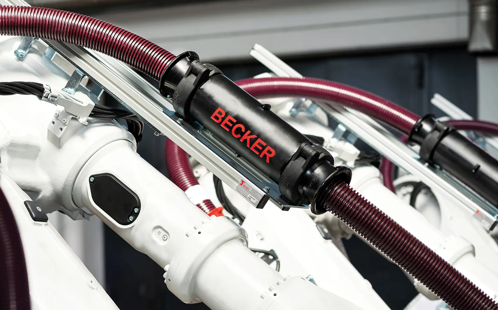 Close-up of a Becker energy supply system on a robot arm